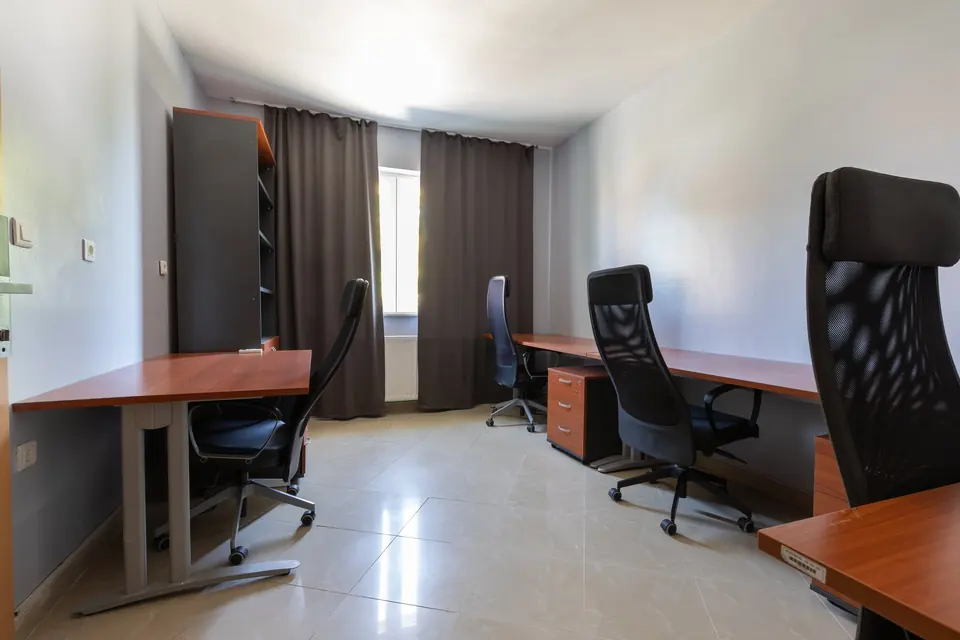 Office with three workstations and office chairs